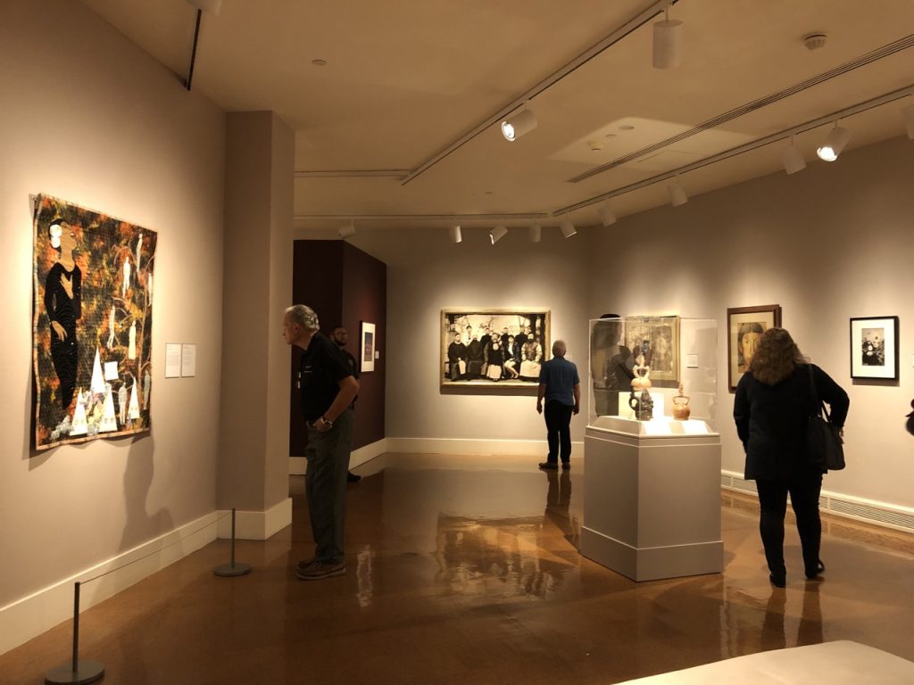 Wide view of people enjoying an exhibit at Dayton Art Institute