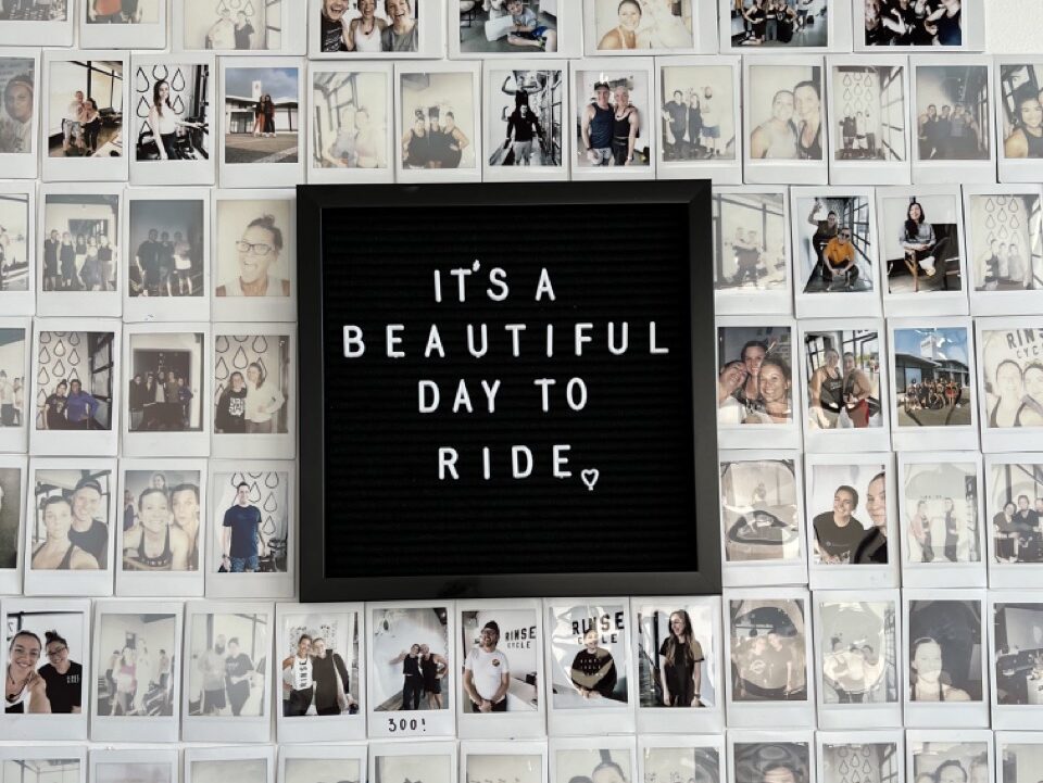 Sign at RINSE CYCLE with text "It's a beautiful day to ride."