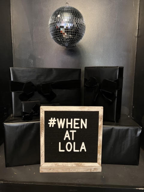 Disco ball and sign at Lola Event Lounge