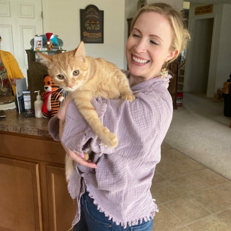 Me holding Nacho the orange kitten