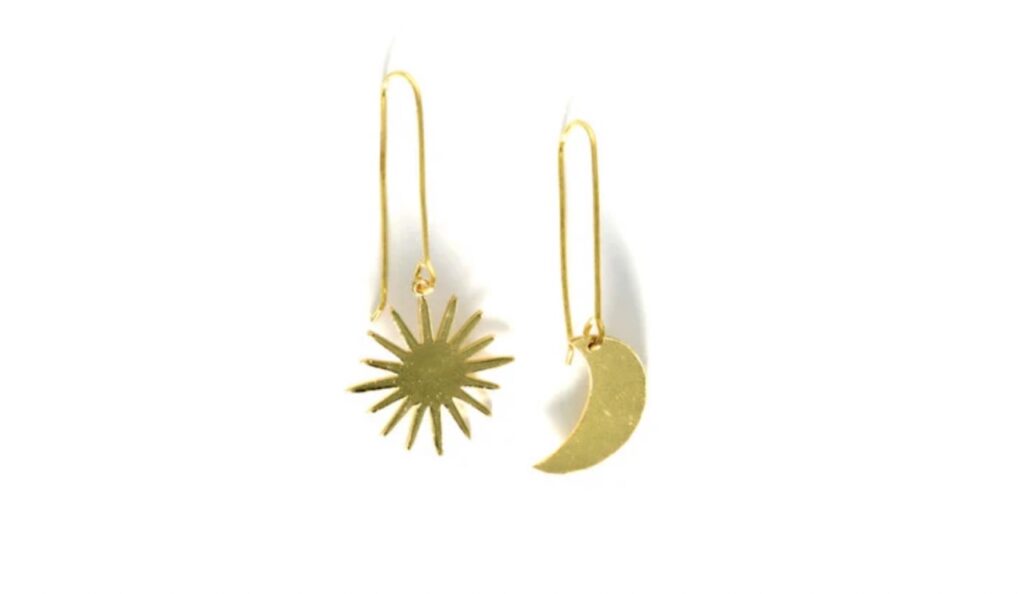 Set of earrings, one is a sun shape, one a moon