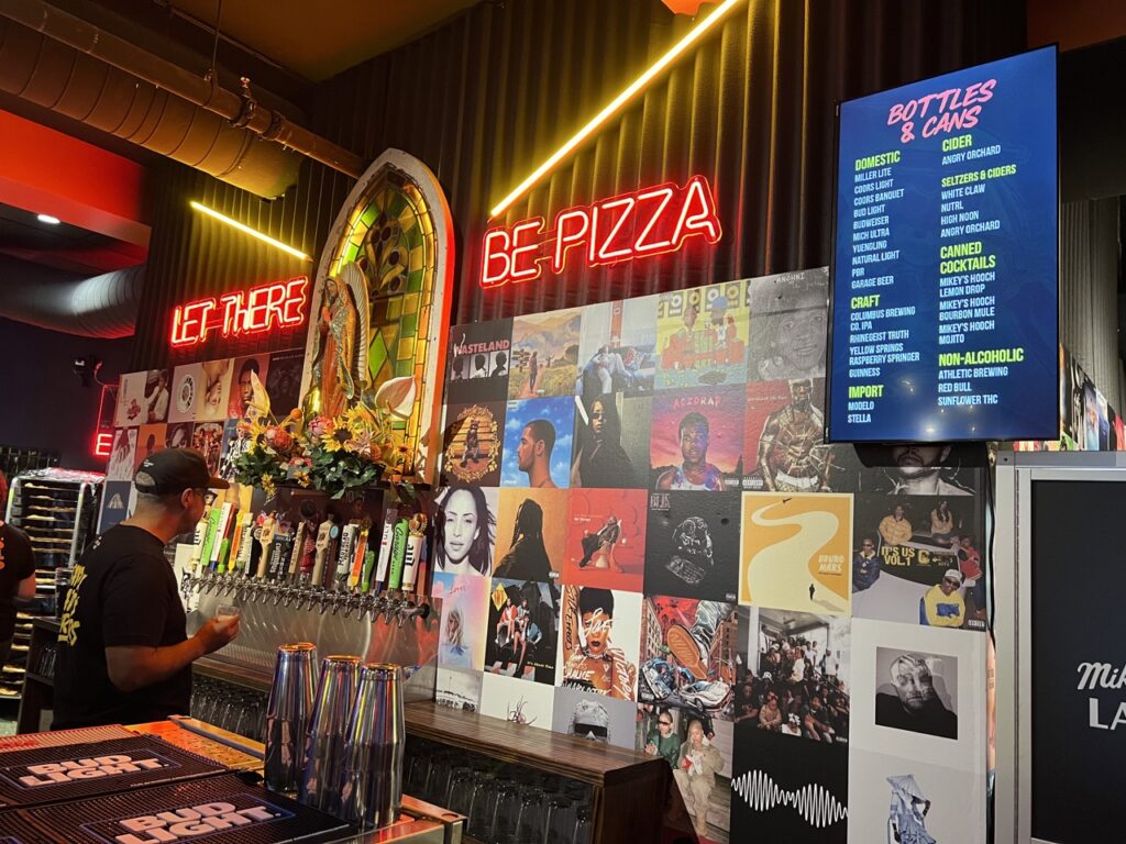 Wall of records at Mikey's Late Night Slice