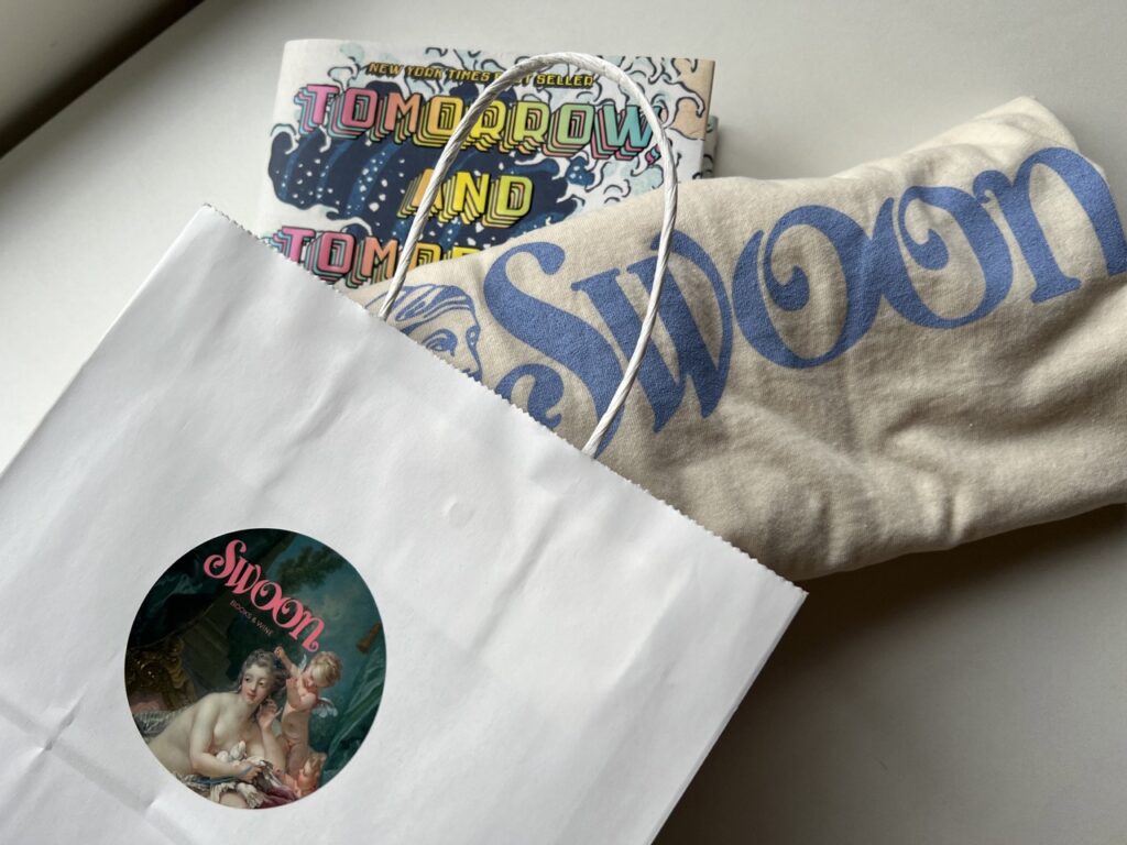 shirt and book from Swoon